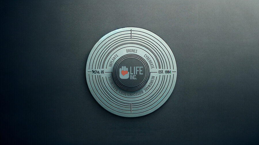 The Life Inc. corporate seal — a metallic disc engraved with division names